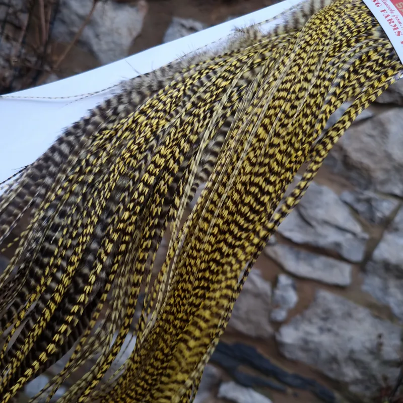 Whiting 1/2 Bronze Grade Dry Fly Rooster Saddle in Grizzly Pale Yellow-1